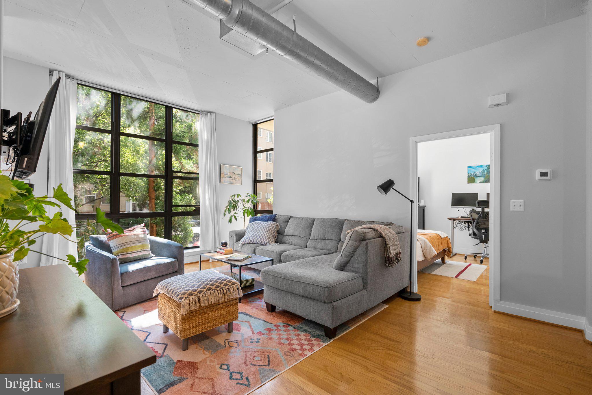 2020 12th Street Northwest, Unit 108 Washington, DC 20009 - Photo 7 of 35 High ceilings, exposed ductwork, oversized windows