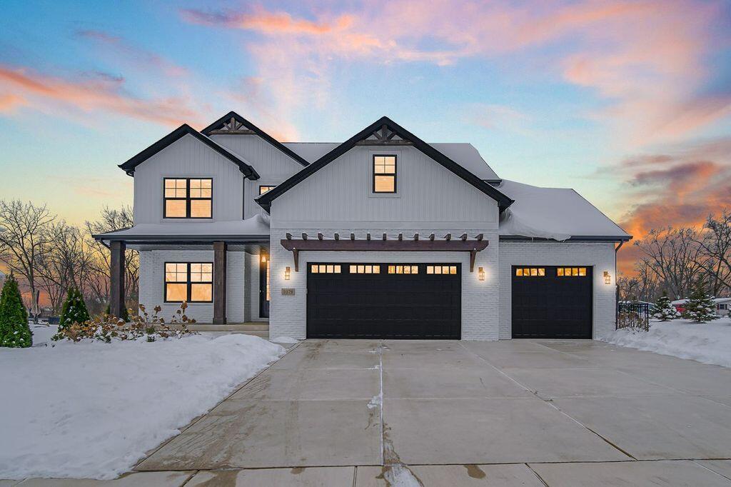 1079 Kleven Lane Crown Point, IN 46307 - Photo 1 of 37 a front view of a house with a yard and garage