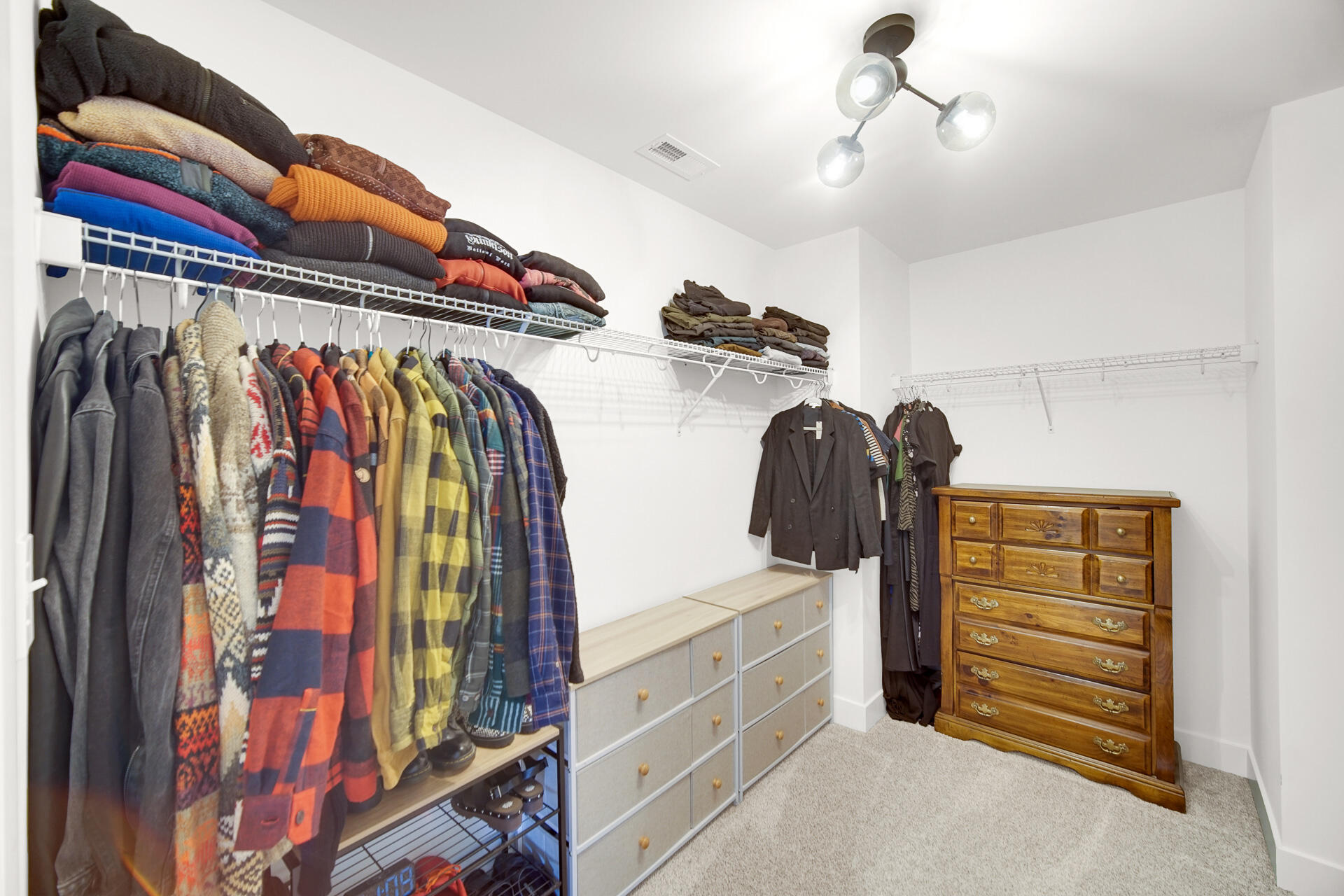 1079 Kleven Lane Crown Point, IN 46307 - Photo 23 of 37 a view of walk in closet with clothes and shoes