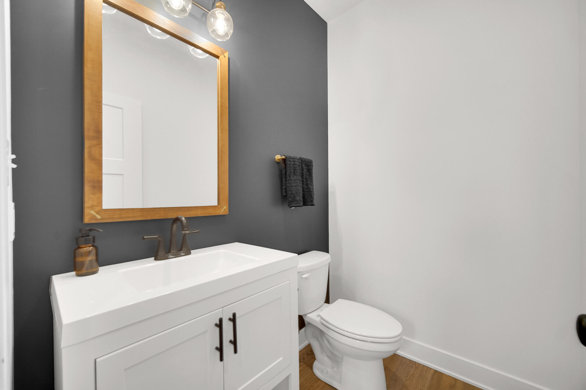 1079 Kleven Lane Crown Point, IN 46307 - Photo 4 of 37 a bathroom with a sink a toilet and mirror