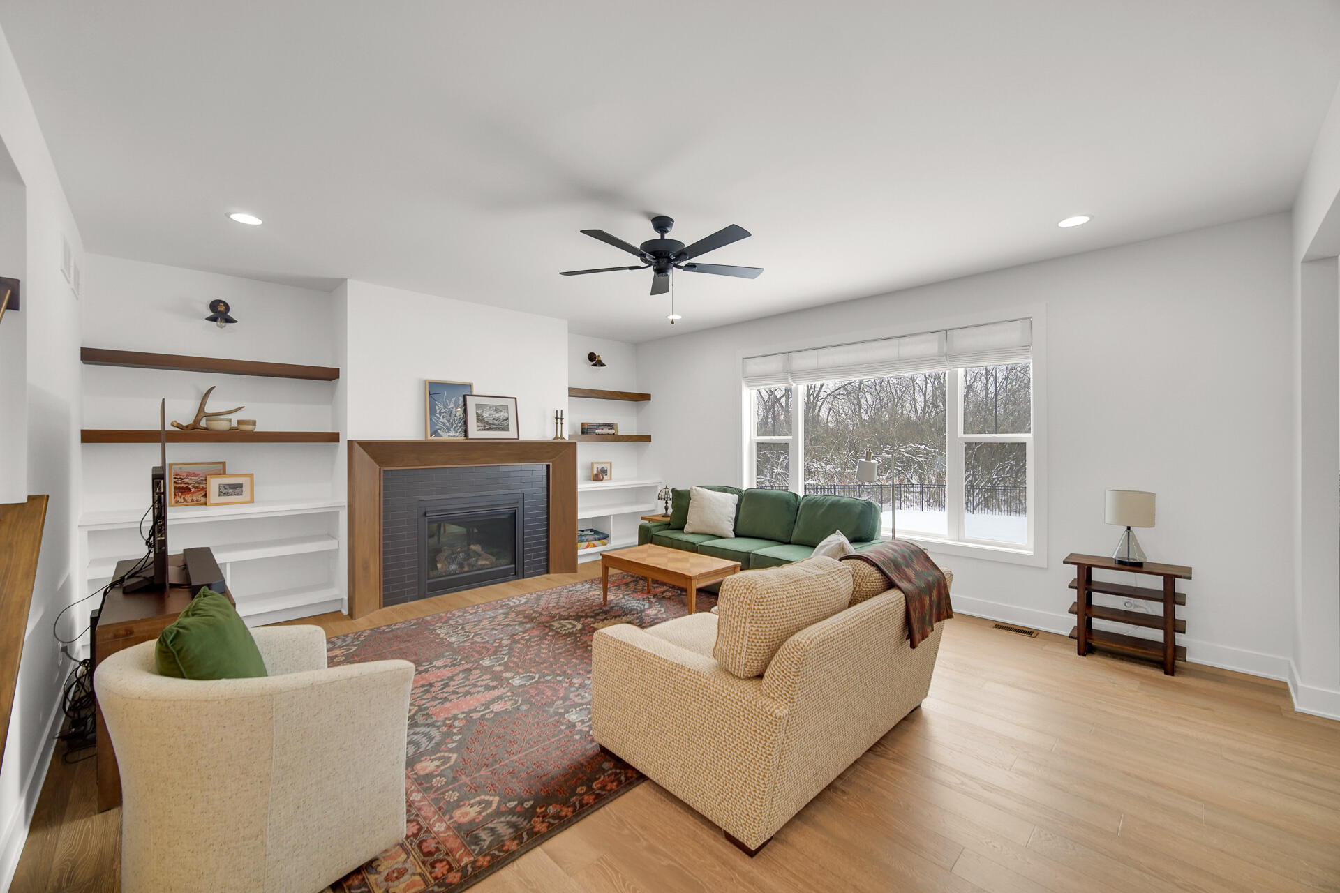1079 Kleven Lane Crown Point, IN 46307 - Photo 7 of 37 a living room with furniture a fireplace and a large window