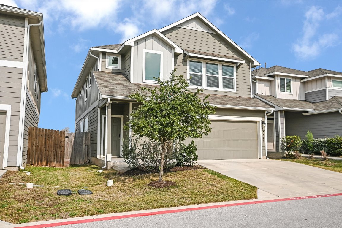 12814 Meachum Lane Manor, TX 78653 - Photo 1 of 20 a front view of a house with garden