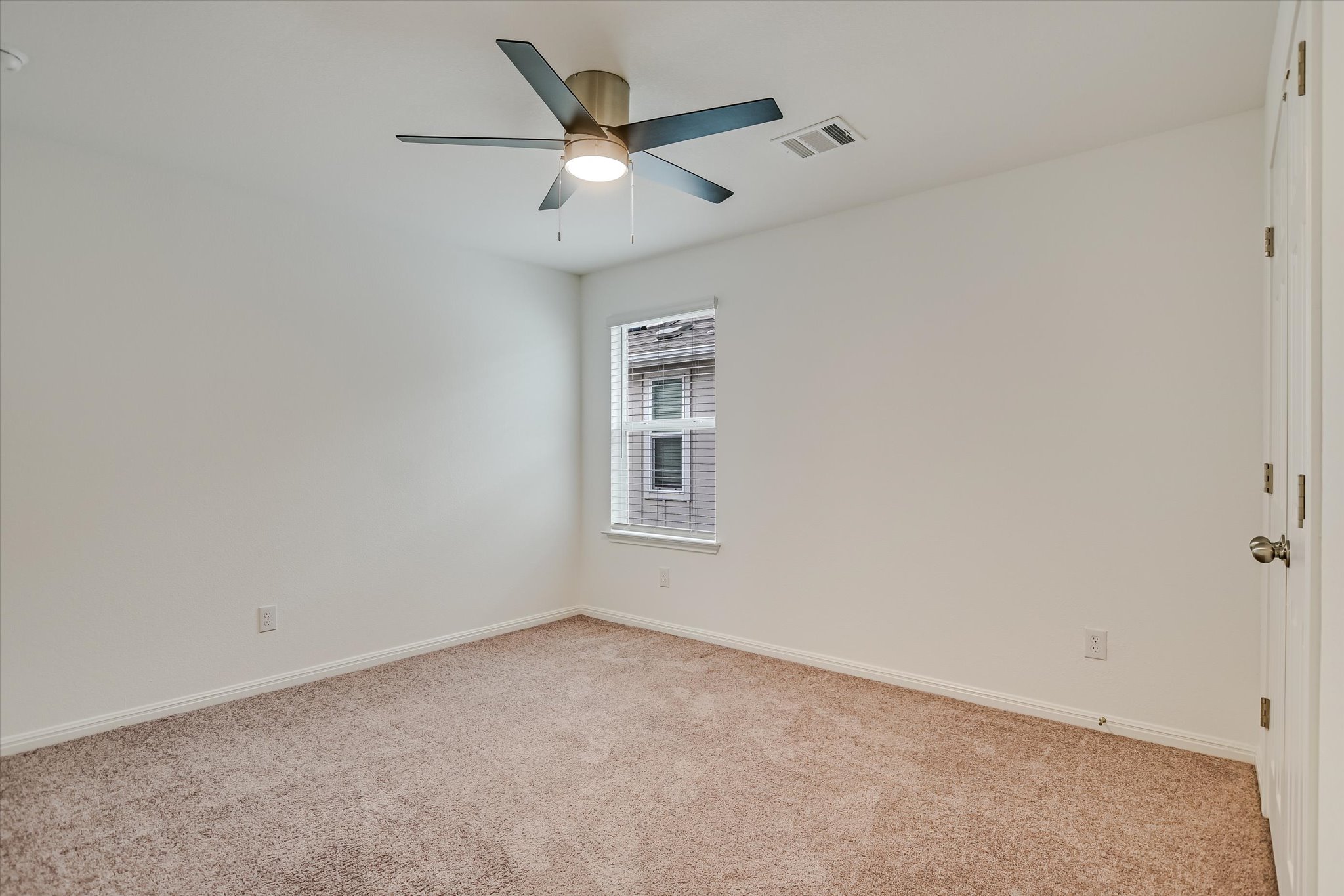 12814 Meachum Lane Manor, TX 78653 - Photo 14 of 20 an empty room with a window and a ceiling fan