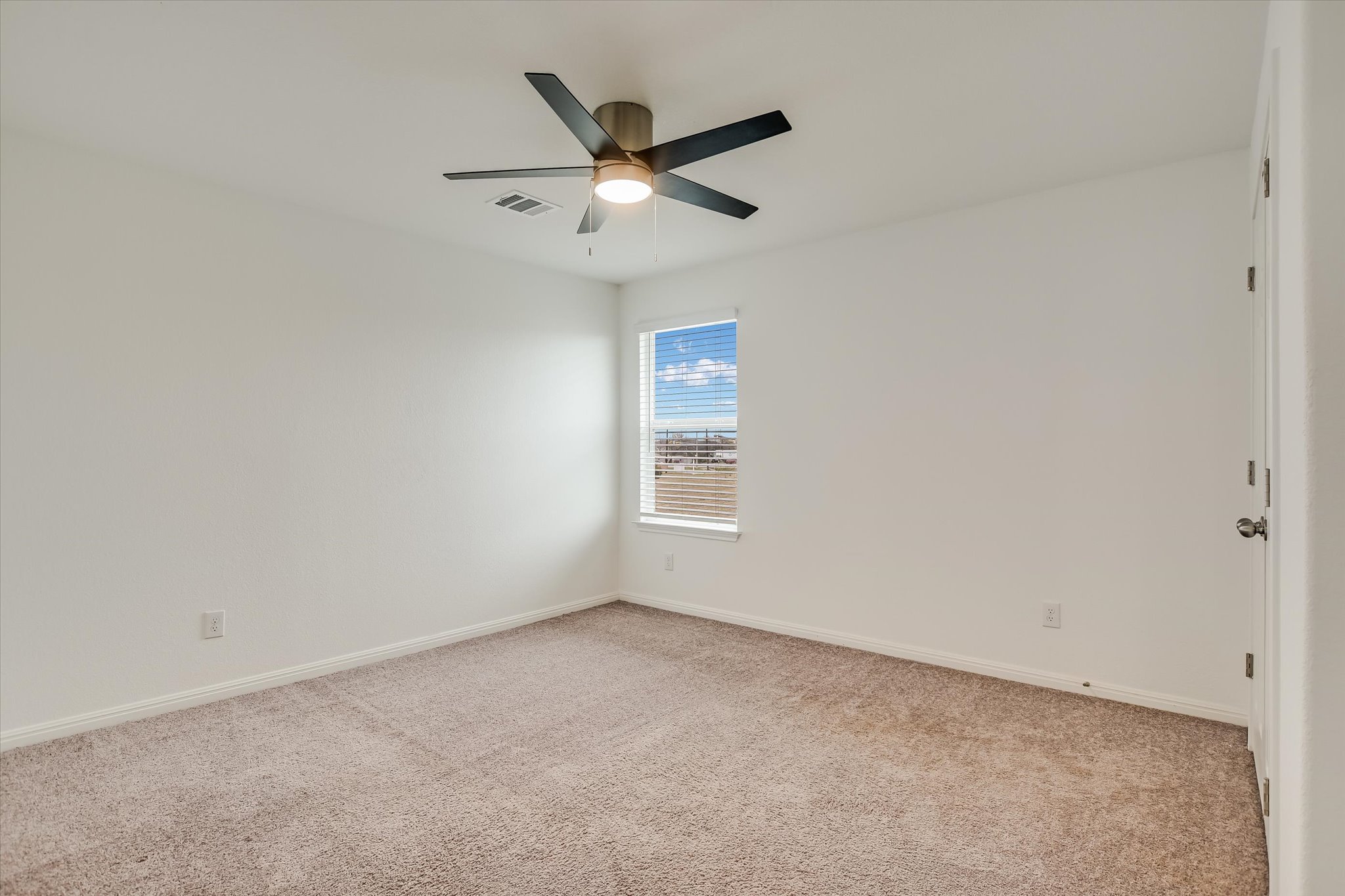 12814 Meachum Lane Manor, TX 78653 - Photo 17 of 20 an empty room with ceiling fan and window