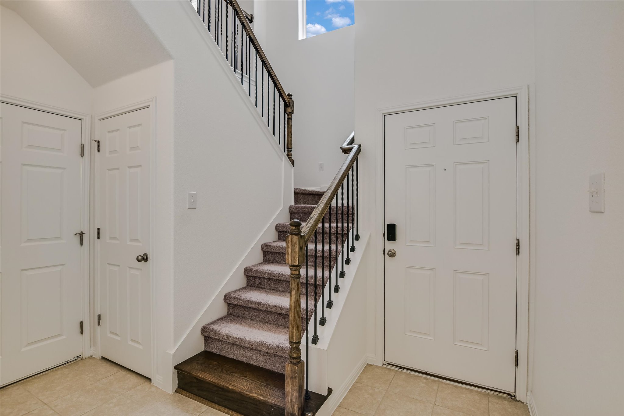 12814 Meachum Lane Manor, TX 78653 - Photo 2 of 20 a view of entryway with white walls and stairs