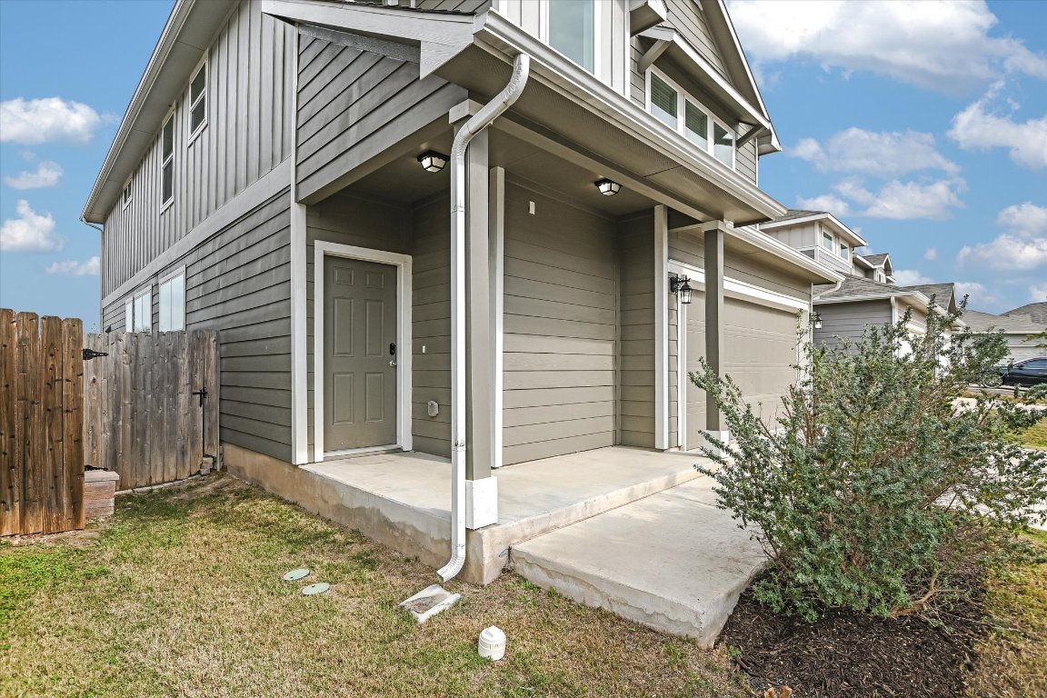12814 Meachum Lane Manor, TX 78653 - Photo 3 of 20 a front view of a house with a garage