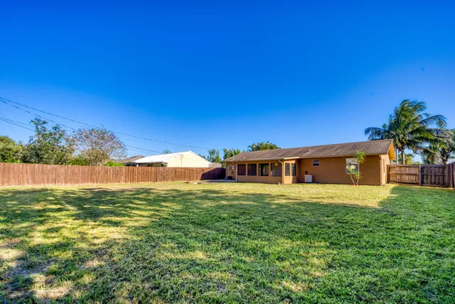 a view of a big yard with a house