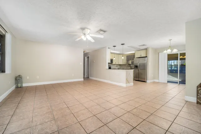 a view of a kitchen with furniture and a kitchen