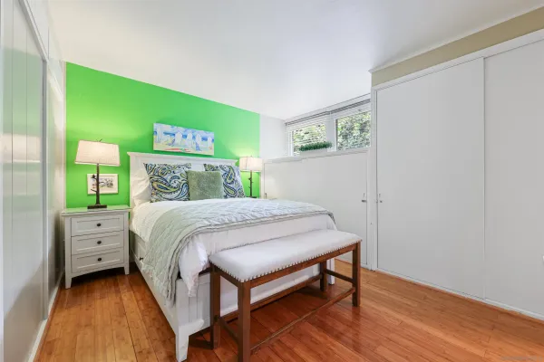 a bedroom with a bed and a dresser