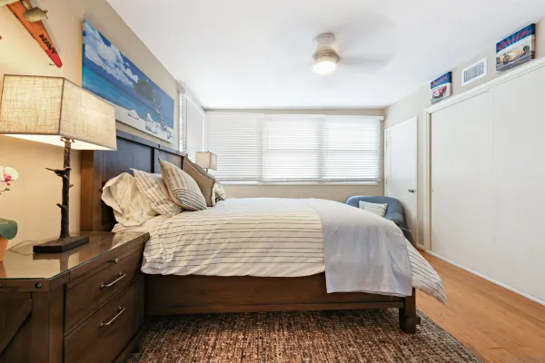 a bedroom with a bed and window