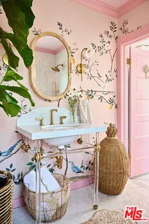 a bedroom with a bed and a lamp