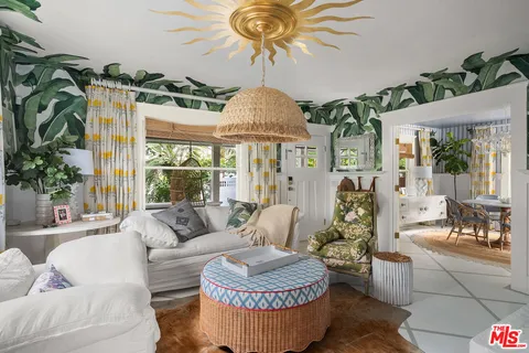 a view of a dining room with furniture and a window