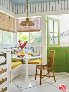 a kitchen with a stove and white cabinets