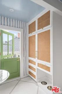 a living room with furniture and a mirror