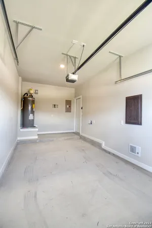 an empty room with a empty space and windows