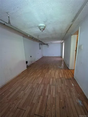 a kitchen with a sink a stove cabinets and a counter top space