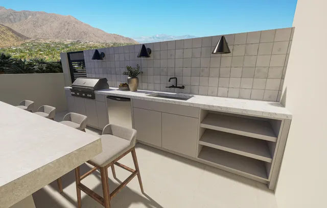 a roof deck with table and chairs