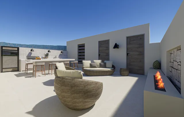 a view of a chairs and table in a terrace