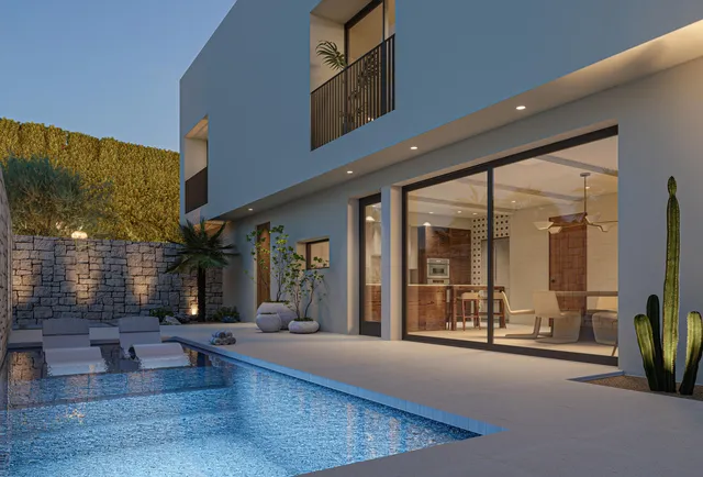 a lobby with furniture and large windows