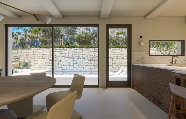 a potted plant sitting on a window sill and a sink
