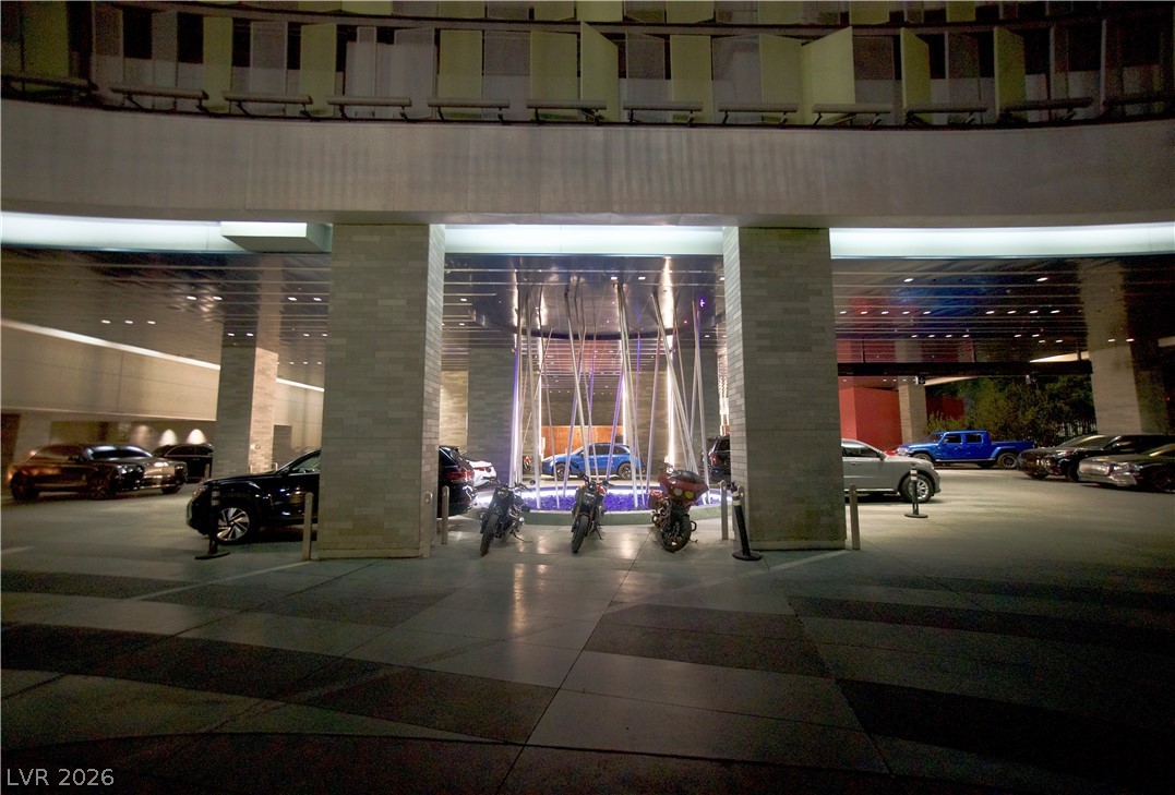 4381 West Flamingo Road, Unit 3616 Las Vegas, NV 89103 - Photo 23 of 29 Grand covered entrance welcomes arrivals, offering shelter and a sense of arrival.