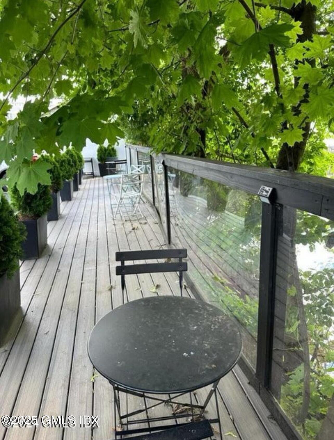 168 North Water Street, Unit 2L Greenwich, CT 06830 - Photo 9 of 11 a view of balcony with wooden floor and outdoor seating
