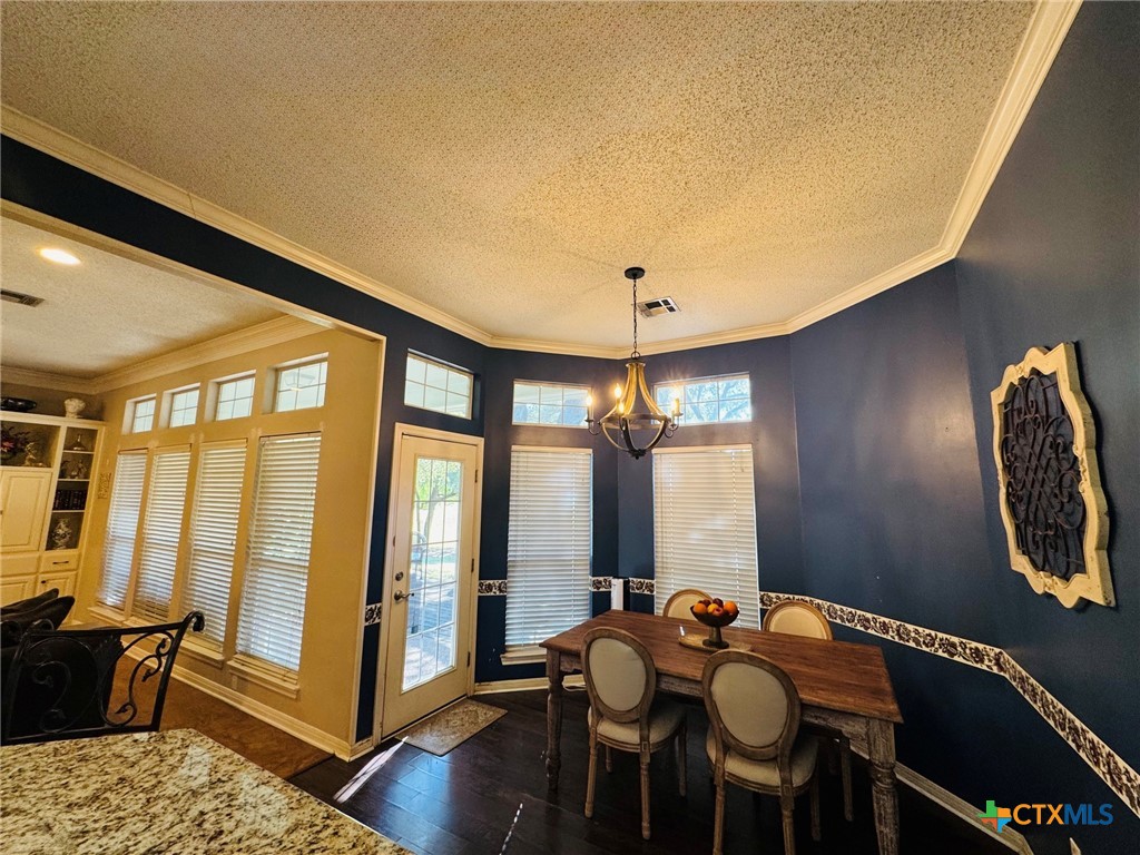 115 Oak Ridge Road Gatesville, TX 76528 - Photo 16 of 37 a view of a dining room with furniture window and wooden floor