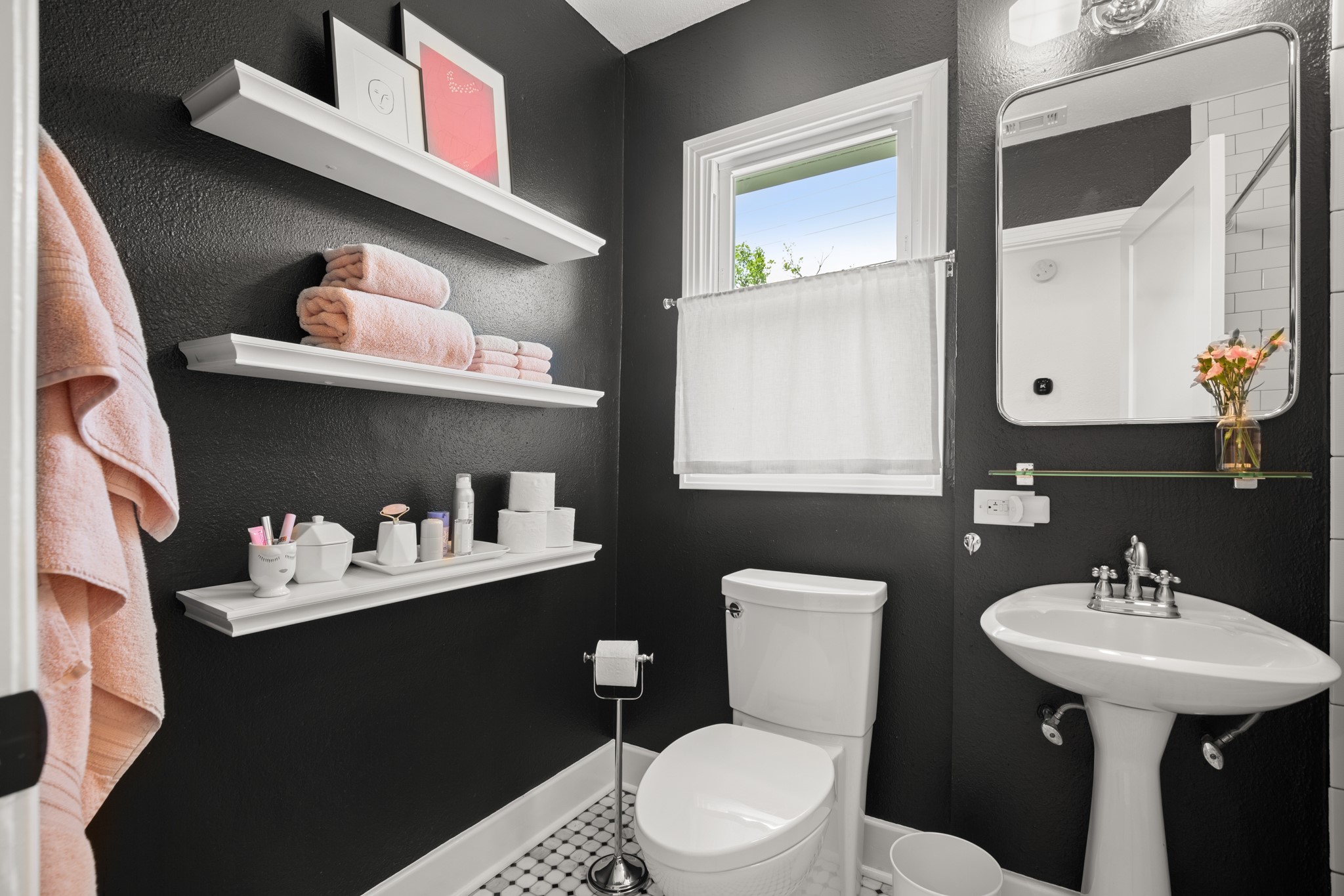 2010 Alegria Road Austin, TX 78757 - Photo 22 of 35 Bathroom featuring a white pedestal sink, toilet, and a window with white trim