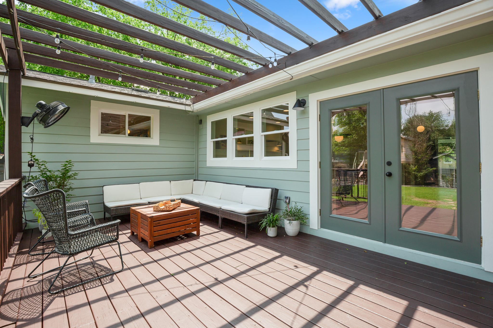 2010 Alegria Road Austin, TX 78757 - Photo 27 of 35 Expansive outdoor deck featuring composite decking, a slatted pergola overhead, and a full-light French door entry