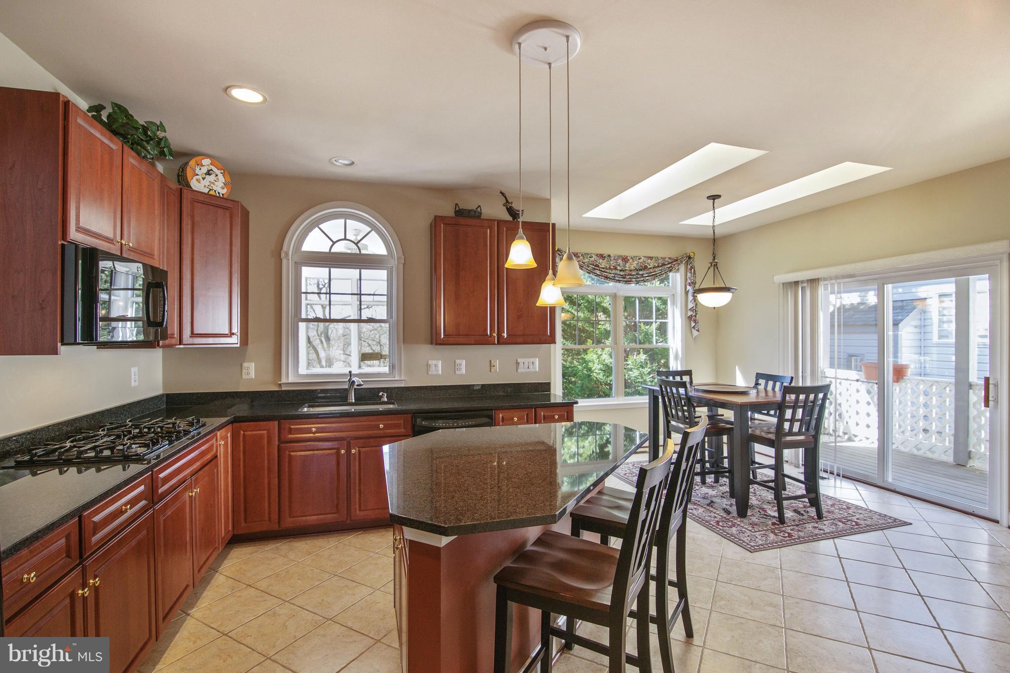 2649 Brook Valley Road Frederick, MD 21701 - Photo 15 of 30 island Kitch-arched window opens to screened porch