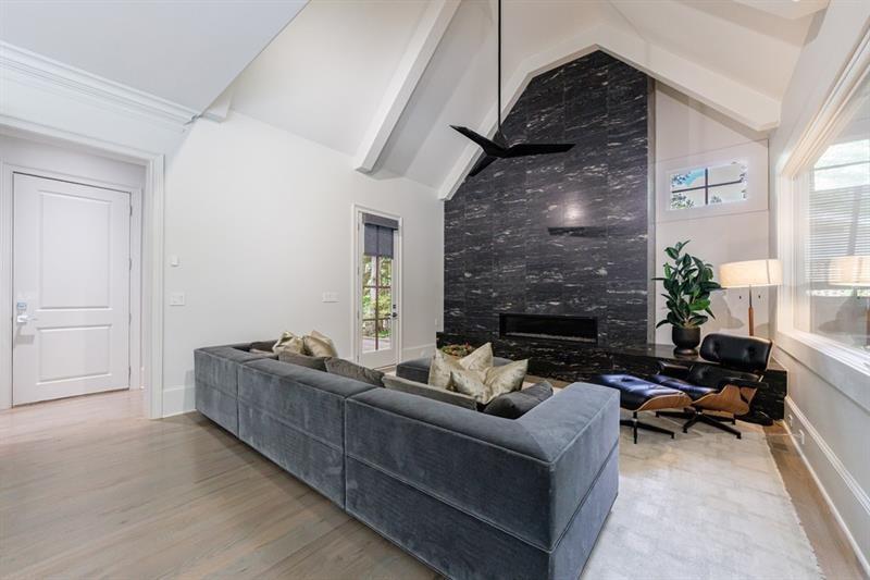3117 West Roxboro Road Northeast Atlanta, GA 30324 - Photo 27 of 78 a living room with furniture and a fireplace