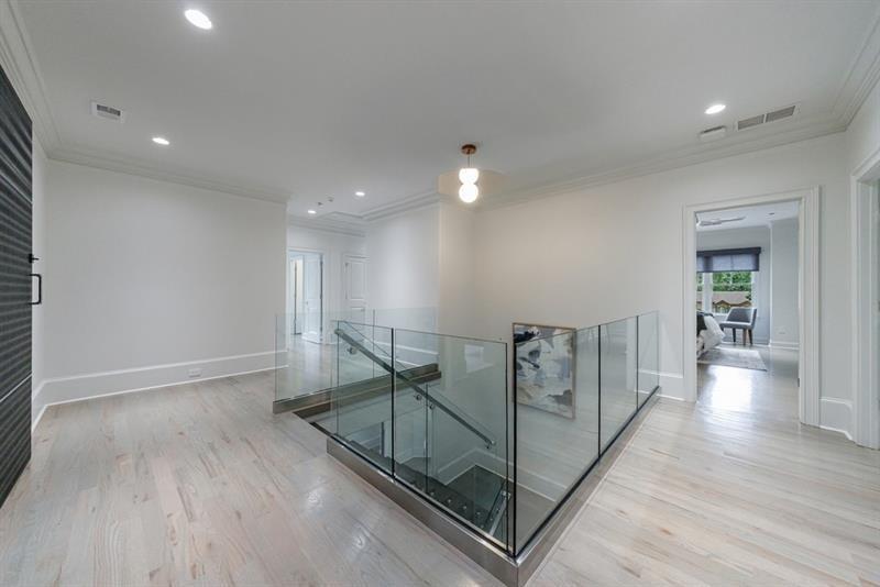3117 West Roxboro Road Northeast Atlanta, GA 30324 - Photo 36 of 78 a view of a hallway with wooden floor