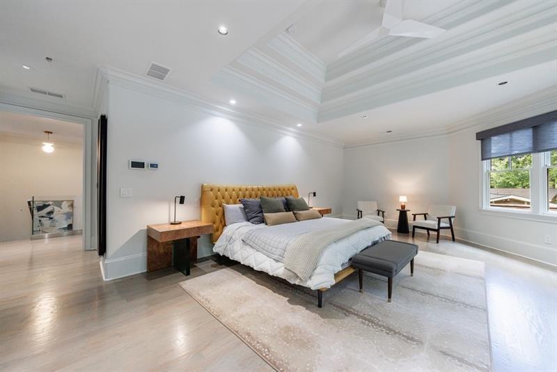 3117 West Roxboro Road Northeast Atlanta, GA 30324 - Photo 38 of 78 a spacious bedroom with a bed and a table