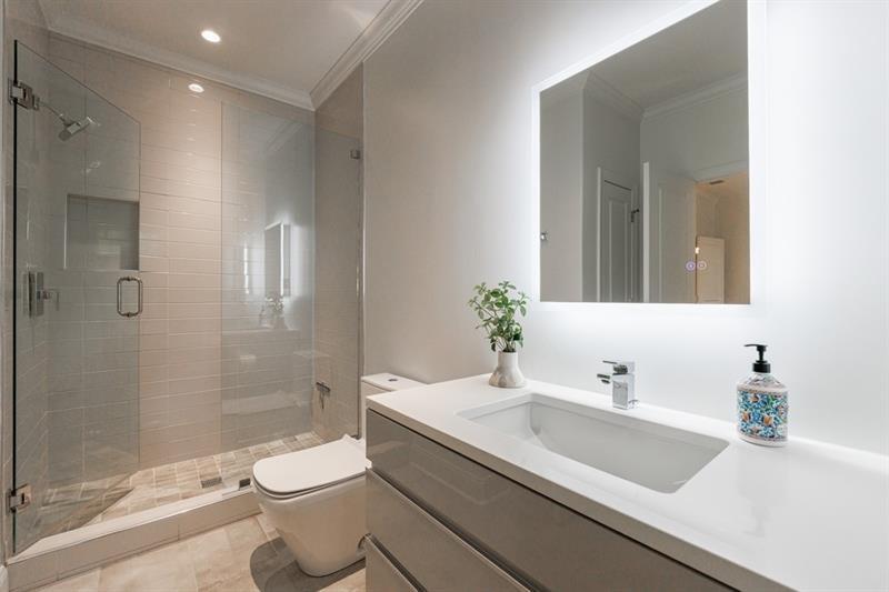 3117 West Roxboro Road Northeast Atlanta, GA 30324 - Photo 47 of 78 a bathroom with a sink a toilet and shower