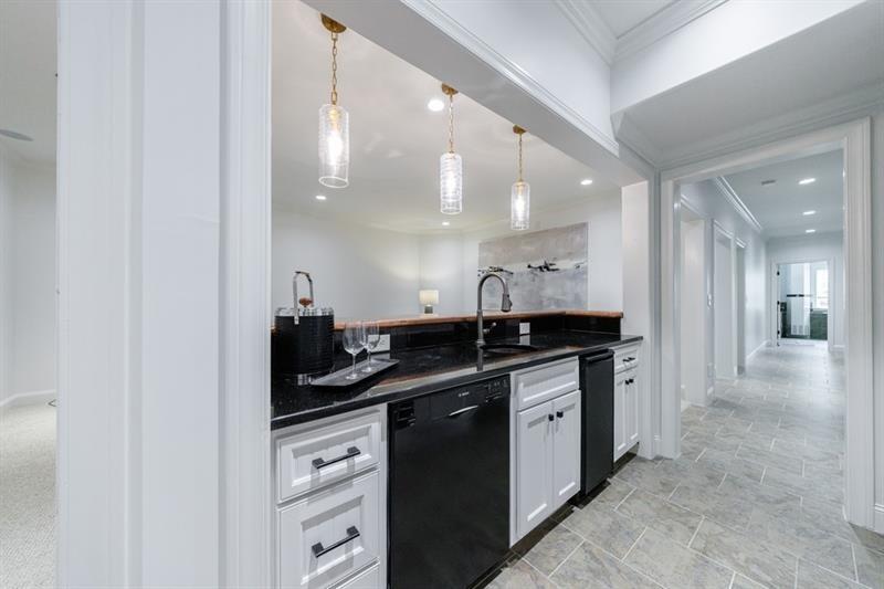 3117 West Roxboro Road Northeast Atlanta, GA 30324 - Photo 54 of 78 a kitchen with a sink and cabinets