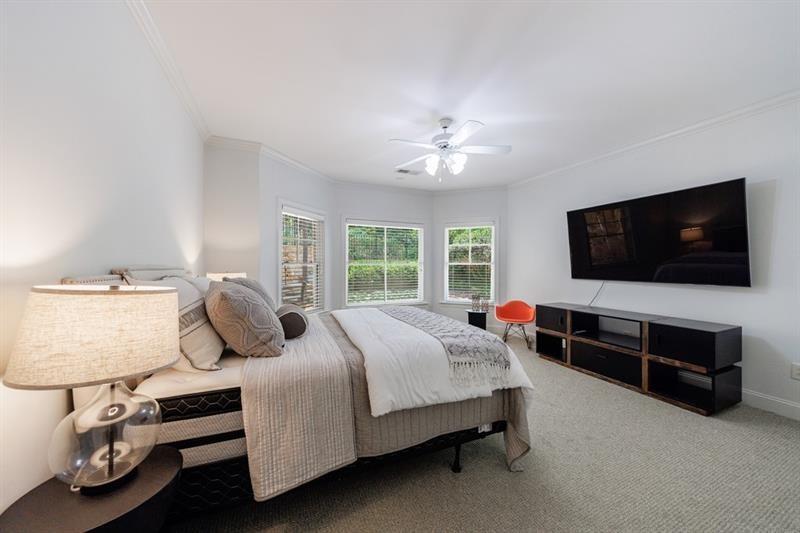 3117 West Roxboro Road Northeast Atlanta, GA 30324 - Photo 56 of 78 a bedroom with a bed and a flat screen tv