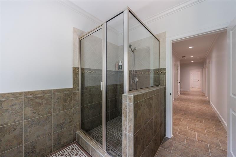 3117 West Roxboro Road Northeast Atlanta, GA 30324 - Photo 58 of 78 a bathroom with a shower and a glass door