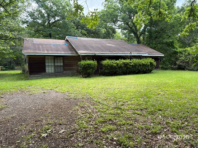 10580 Greenridge Road Conroe, TX 77303 - Photo 1 of 10 a view of a house with garden and yard