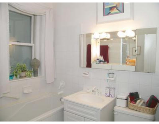 132 Sewall Avenue, Unit B Brookline, MA 02446 - Photo 18 of 18 a bathroom with a sink and a mirror