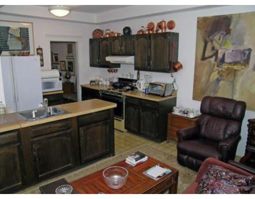 132 Sewall Avenue, Unit B Brookline, MA 02446 - Photo 7 of 18 a living room with stainless steel appliances kitchen island granite countertop furniture a refrigerator and a sink