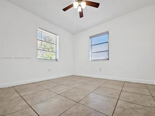 a view of an empty room with a window