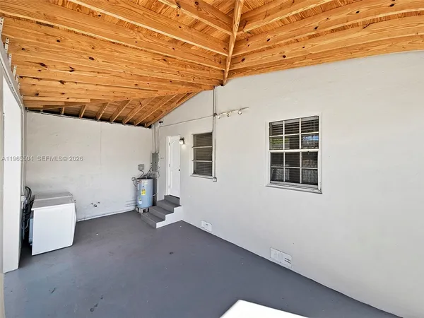a view of a house with a yard porch and sitting area