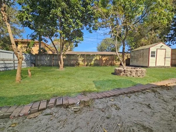 a view of a backyard of the house