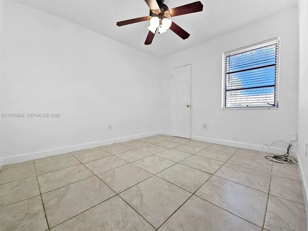 a view of an empty room and window
