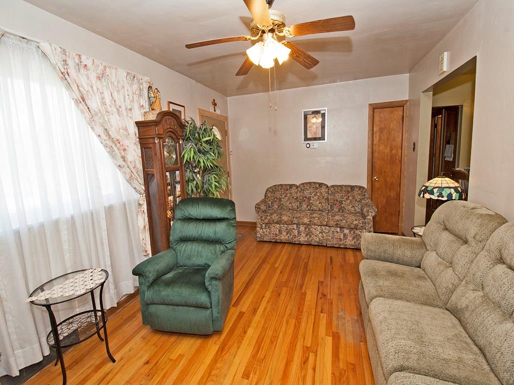 2166 Butler Logan Road Tarentum, PA 15084 - Photo 4 of 25 Living Room - The large window allows plenty of light to enter the room. This home has hardwood floors, central air, ceiling fans & plenty of storage throughout.