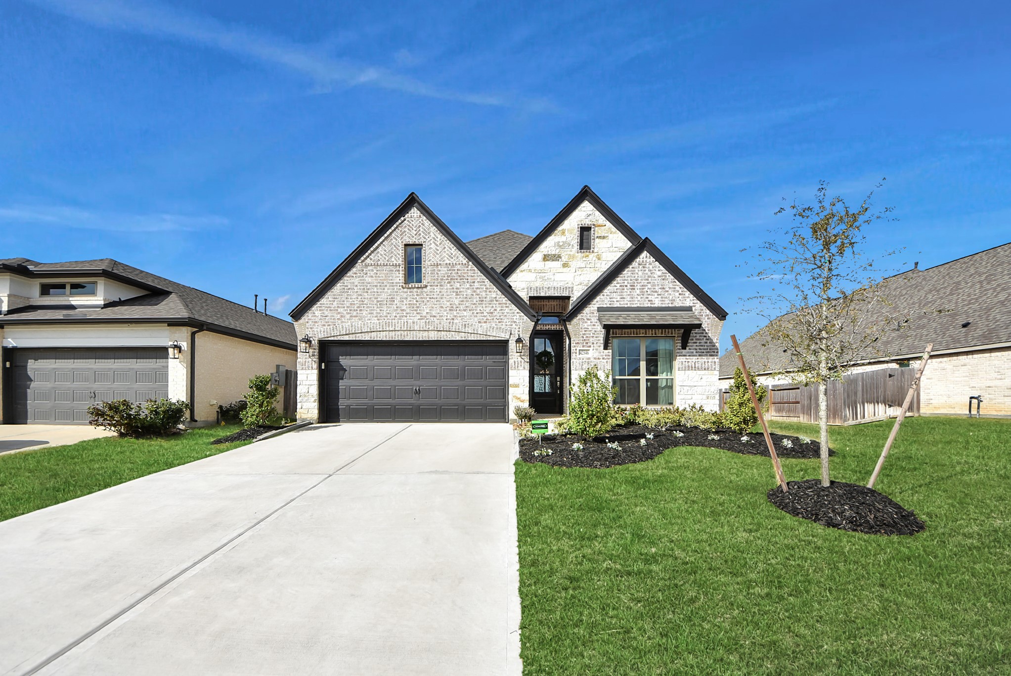 Welcome Home in Escondido zoned to Magnolia ISD! A charming, Perry Home featuring a two-car garage, brick and stone.
