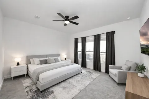 a bedroom with a large bed and a window