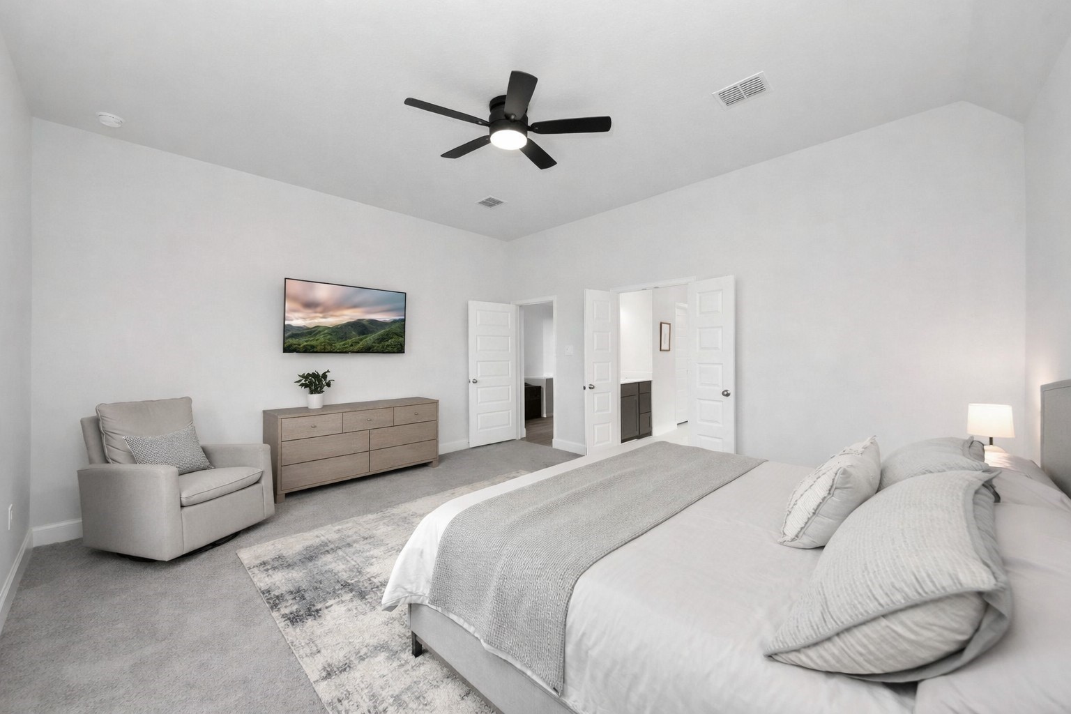 42546 Summer Crst Road Magnolia, TX 77354 - Photo 14 of 27 Retreat in your owners suite featuring, custom modern ceiling fan, French doors, rays of natural light and high ceilings.