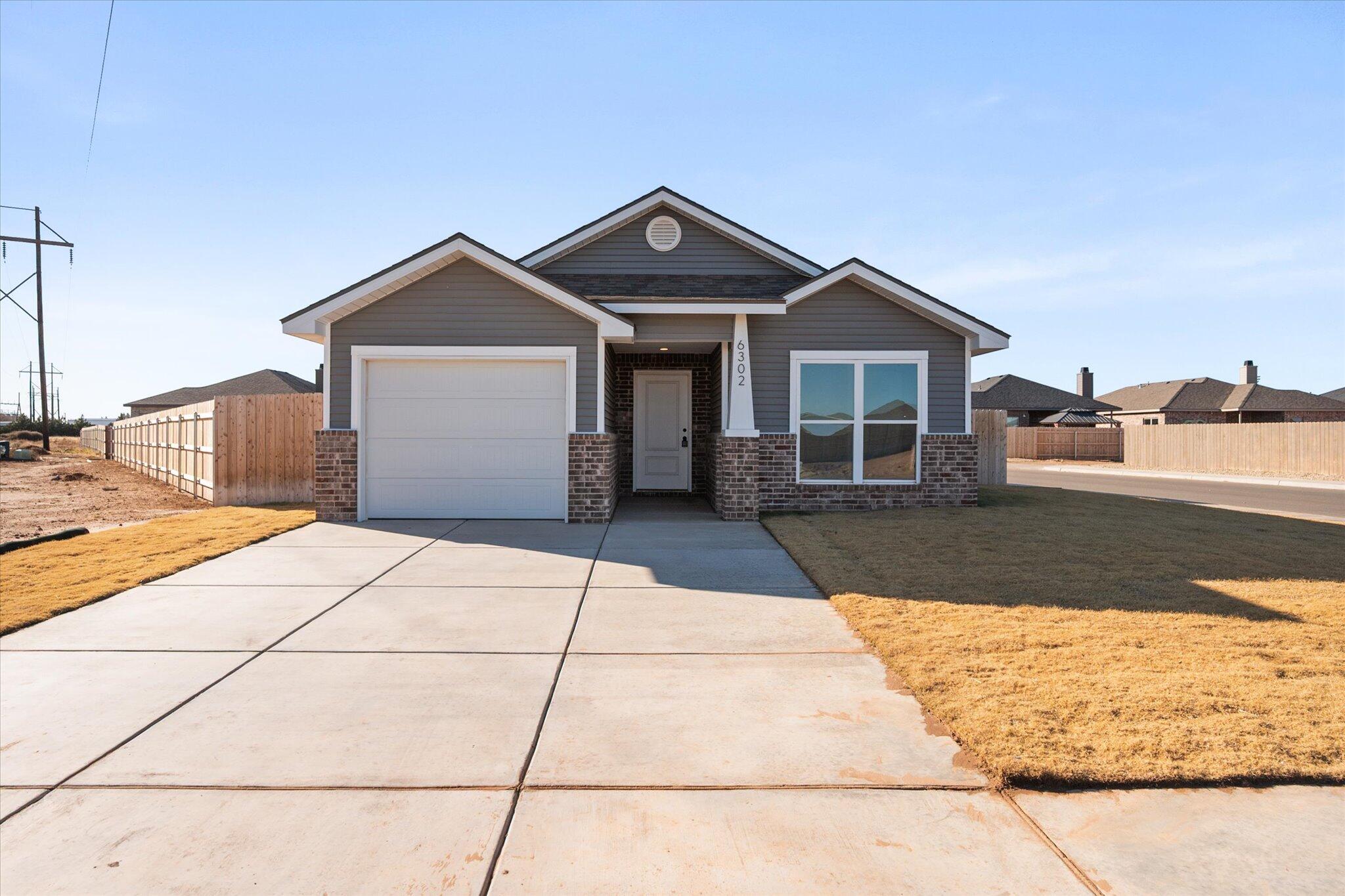 6302 Volney Avenue Lubbock, TX 79407 - Photo 1 of 20 a view of a house with a yard