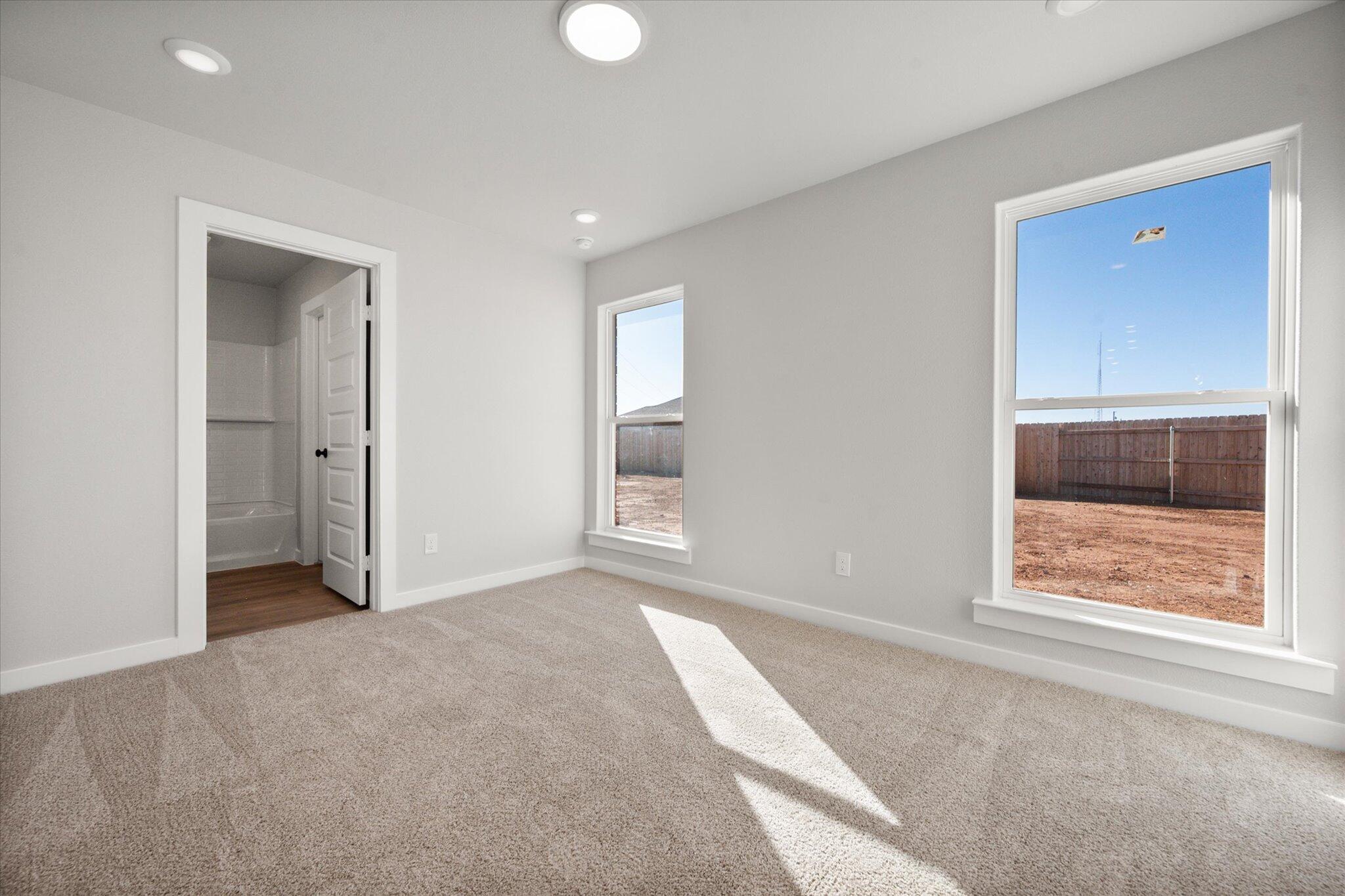 6302 Volney Avenue Lubbock, TX 79407 - Photo 13 of 20 an empty room with windows and closet